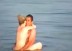 Homemade video of a couple swimming naked and also getting down and dirty in the lake