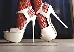 Sexy Foot Fetish Tease in Spiked Heels and Red Fishnet Stockings