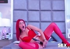 Redheaded babe teases herself to orgasm in lingerie